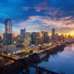 a city skyline at sunset
